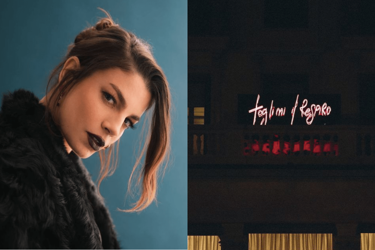 Emma Marrone con pelliccia nera e parole al neon della nuova canzone